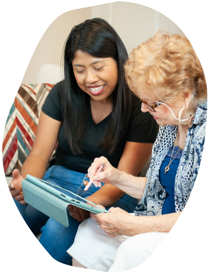 Two women looking at an iPad together